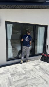 Excellent Sliding Door technician testing repaired sliding door in Lutz FL