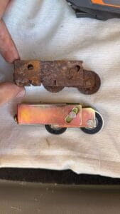 Rusted rollers replaced during sliding door repair in Palm Harbor